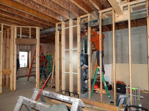 Installing ductwork in the Lower Level.