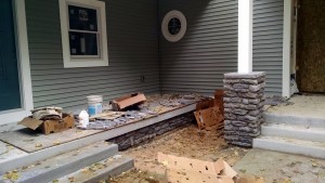 Stone at front porch column and side porch.